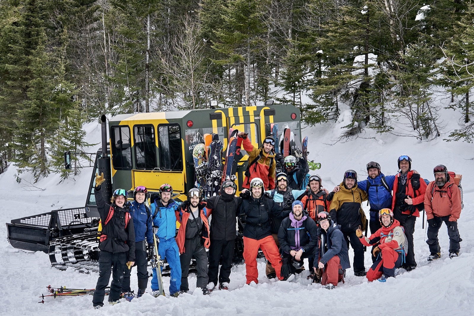 Entrepreneur fathers on a backcountry ski adventure beside a snowcat