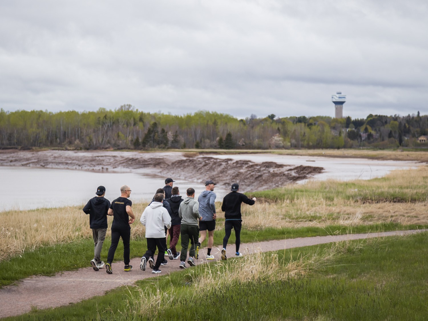 Entrepreneur fathers gathered together by the water at a DrivenDad retreat